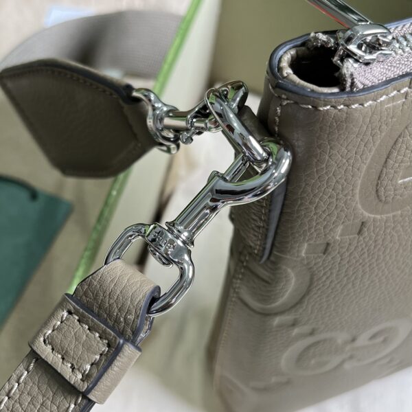 Gucci GG EMBOSSED MEDIUM MESSENGER BAG