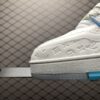 White and blue low-top casual sneakers