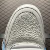 White and blue low-top casual sneakers