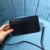 YSL CASSANDRE PHONE HOLDER WITH STRAP